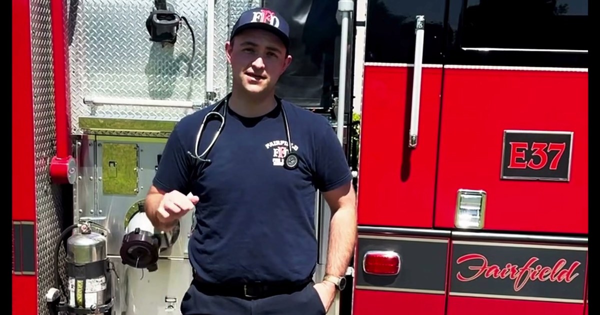 Fairfield Fire Department paramedic intern Dawson Deldotto standing beside Engine 37
